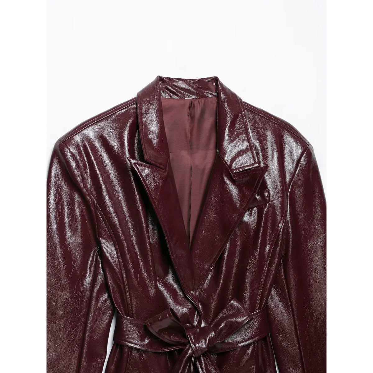 Close-up of notch lapel and tied self belt on burgundy leather look blazer