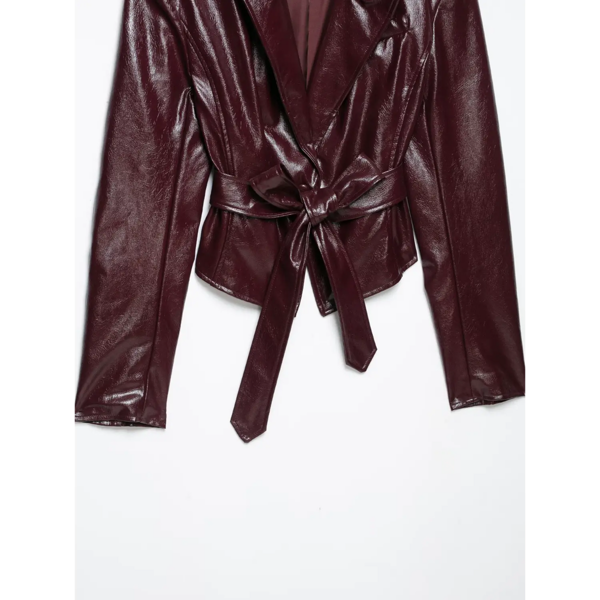 Close-up of front with self tie belt knotted at waist on burgundy leather blazer