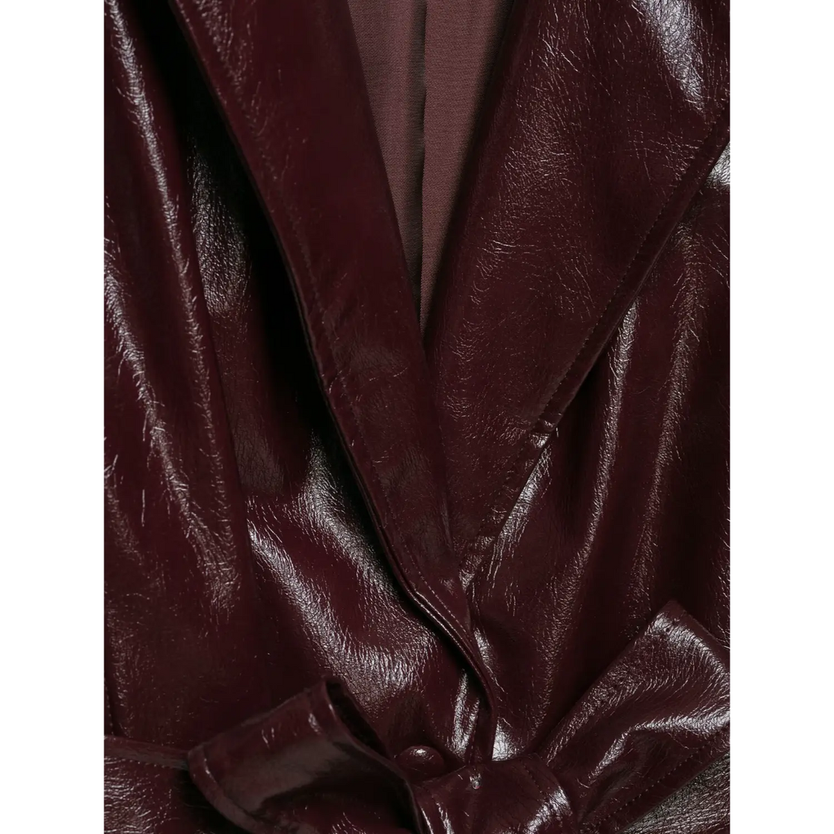 Close-up of notch lapel and burgundy inner lining on leather blazer