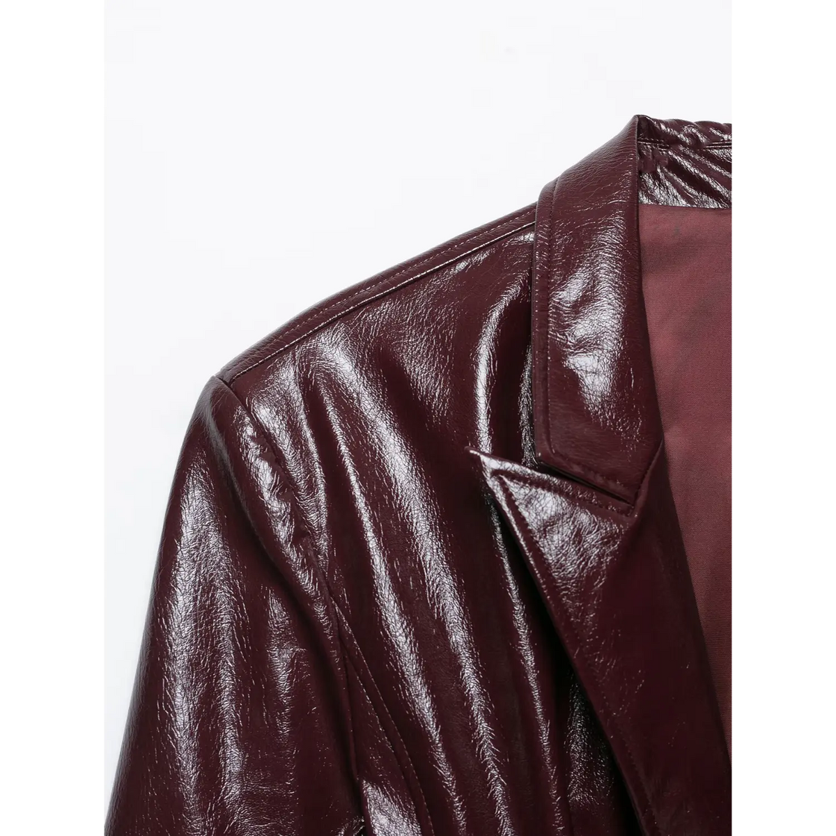 Close-up of notch lapel and shoulder on burgundy glossy leather blazer