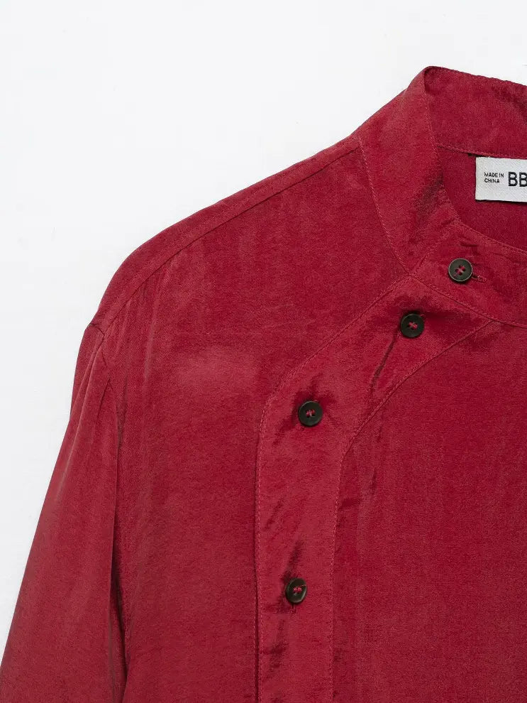 Close-up of shoulder and diagonal button placket