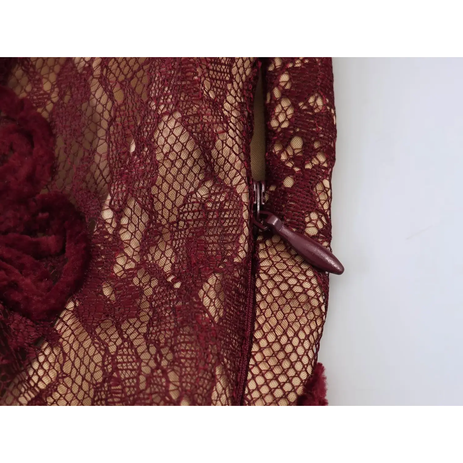 Close‑up side invisible zipper detail burgundy floral lace maxi dress
