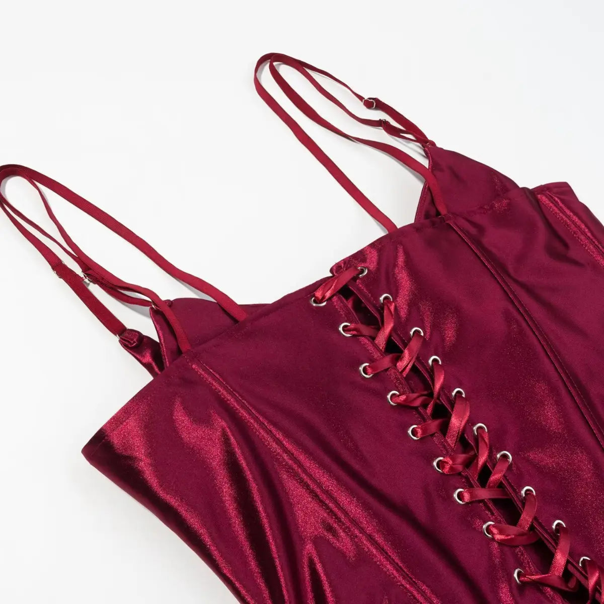 Full front view of burgundy metallic corset top, showing the lace-up front, double straps, and structured boning