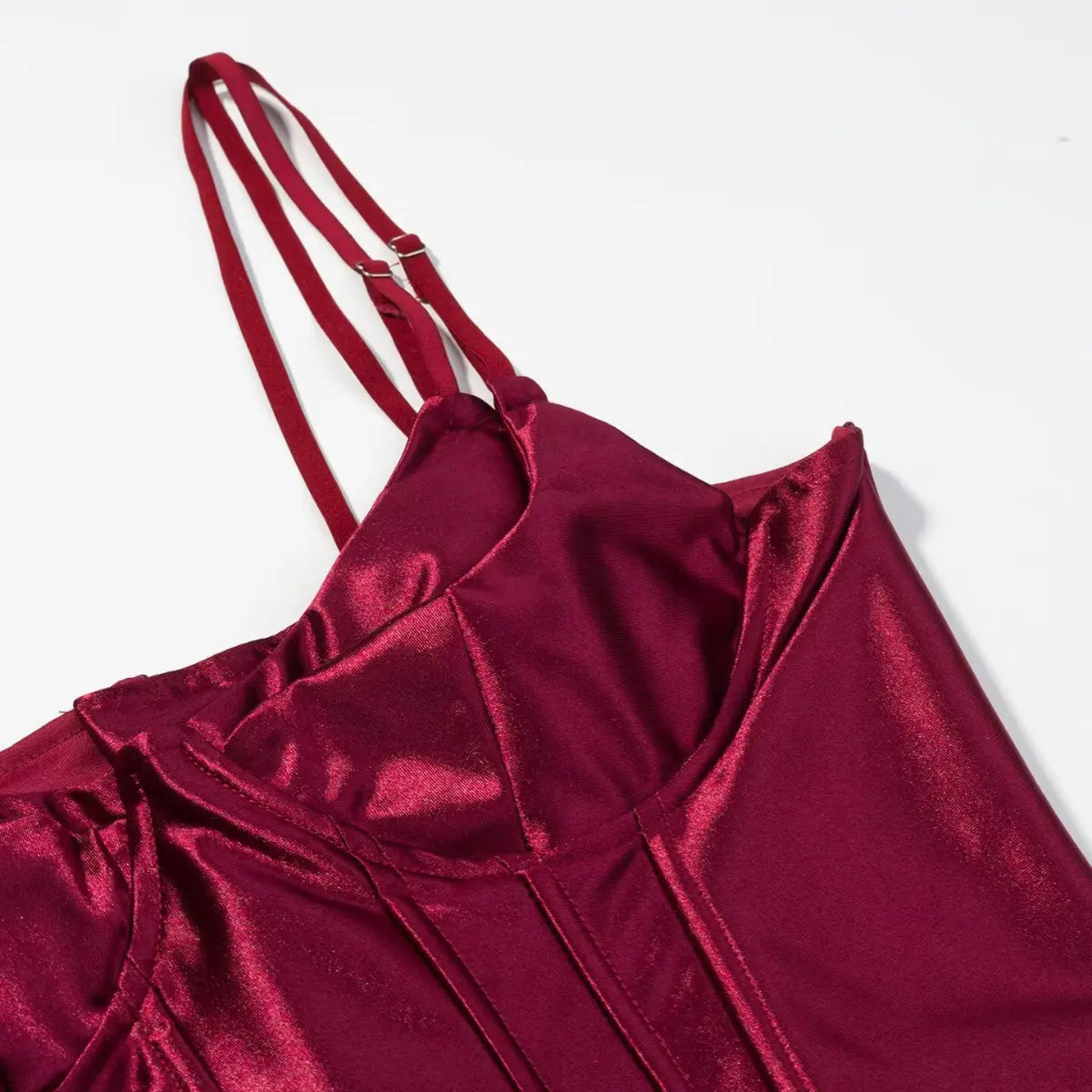  Neckline and strap detail of burgundy metallic corset top, showing the sweetheart cut and adjustable sliders