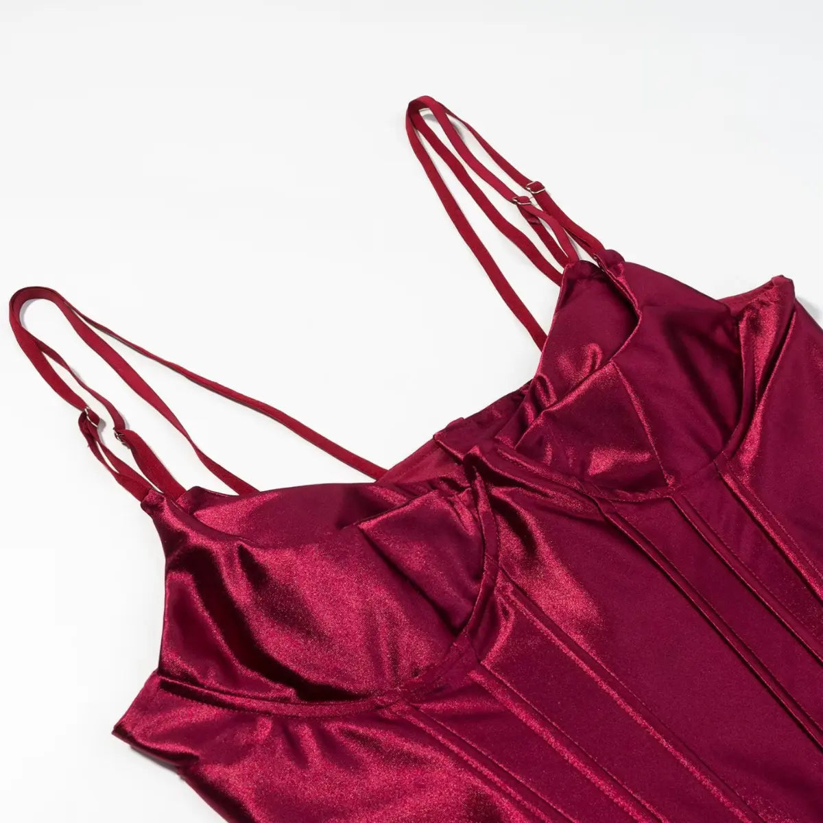 Shoulder detail of burgundy metallic corset top, showing the double adjustable straps and boning