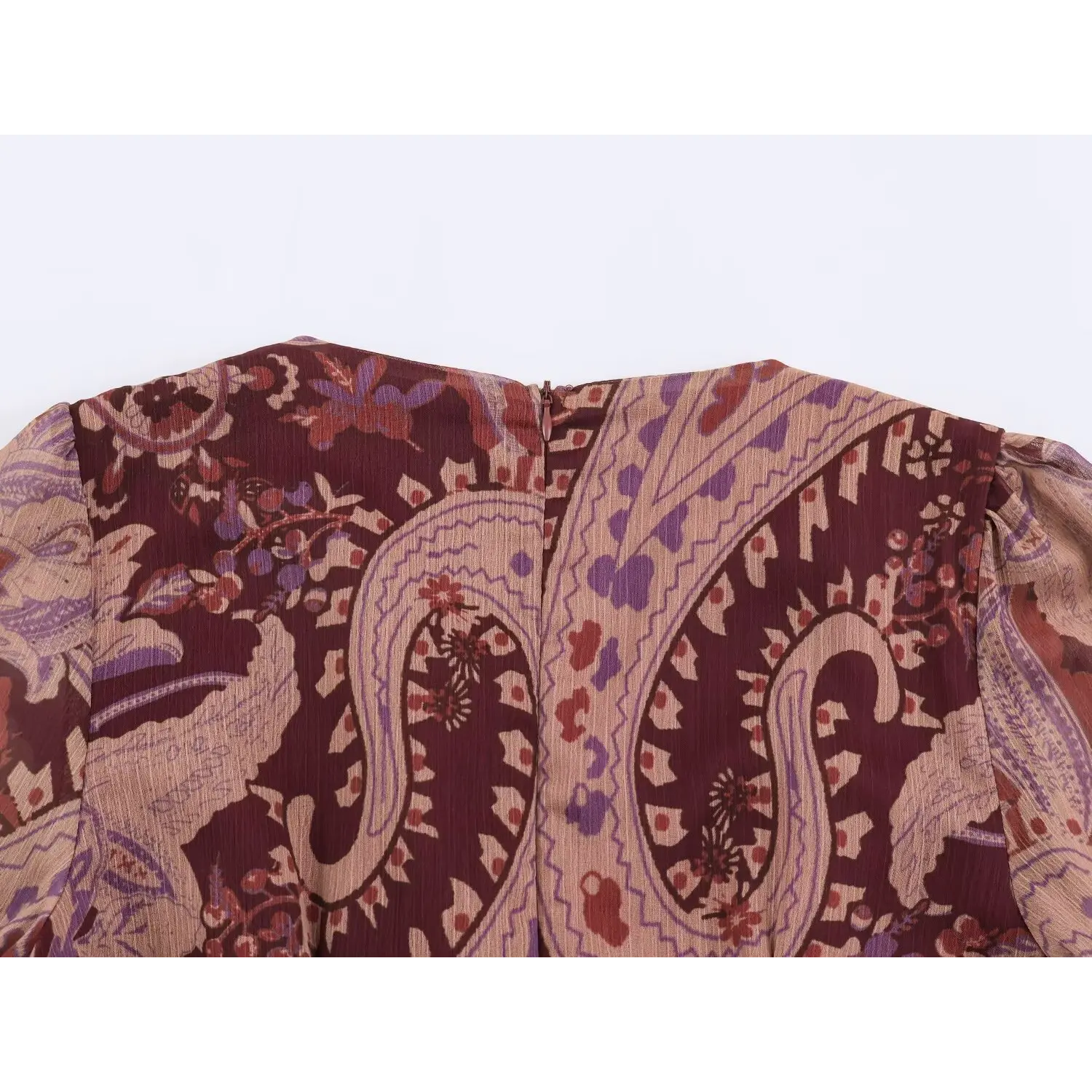 Top view of back neck hidden zipper on burgundy paisley boho mini dress