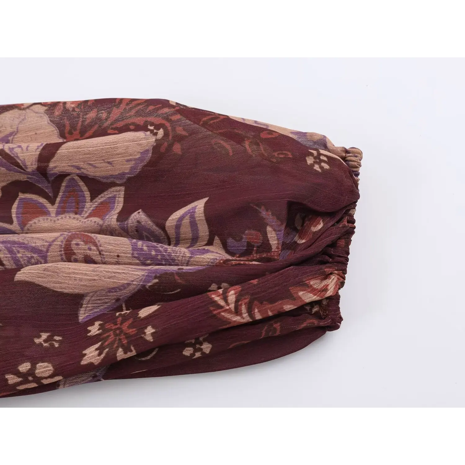 Close-up of elasticated cuff design on voluminous long balloon sleeve