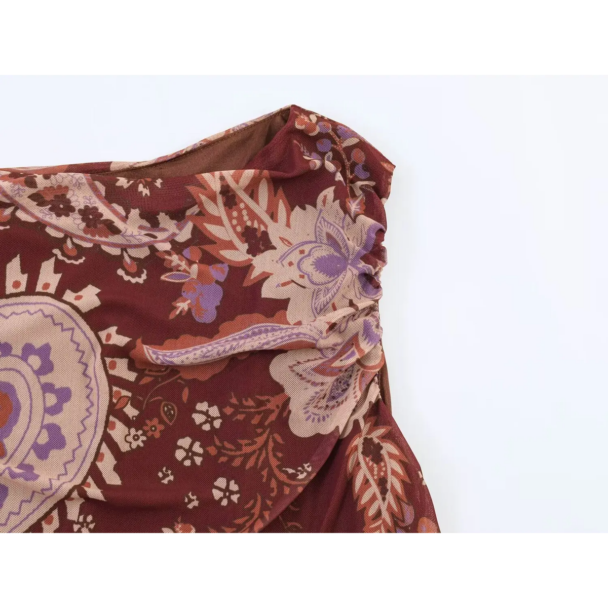 Macro shot of shoulder ruched mesh fabric with vintage paisley print