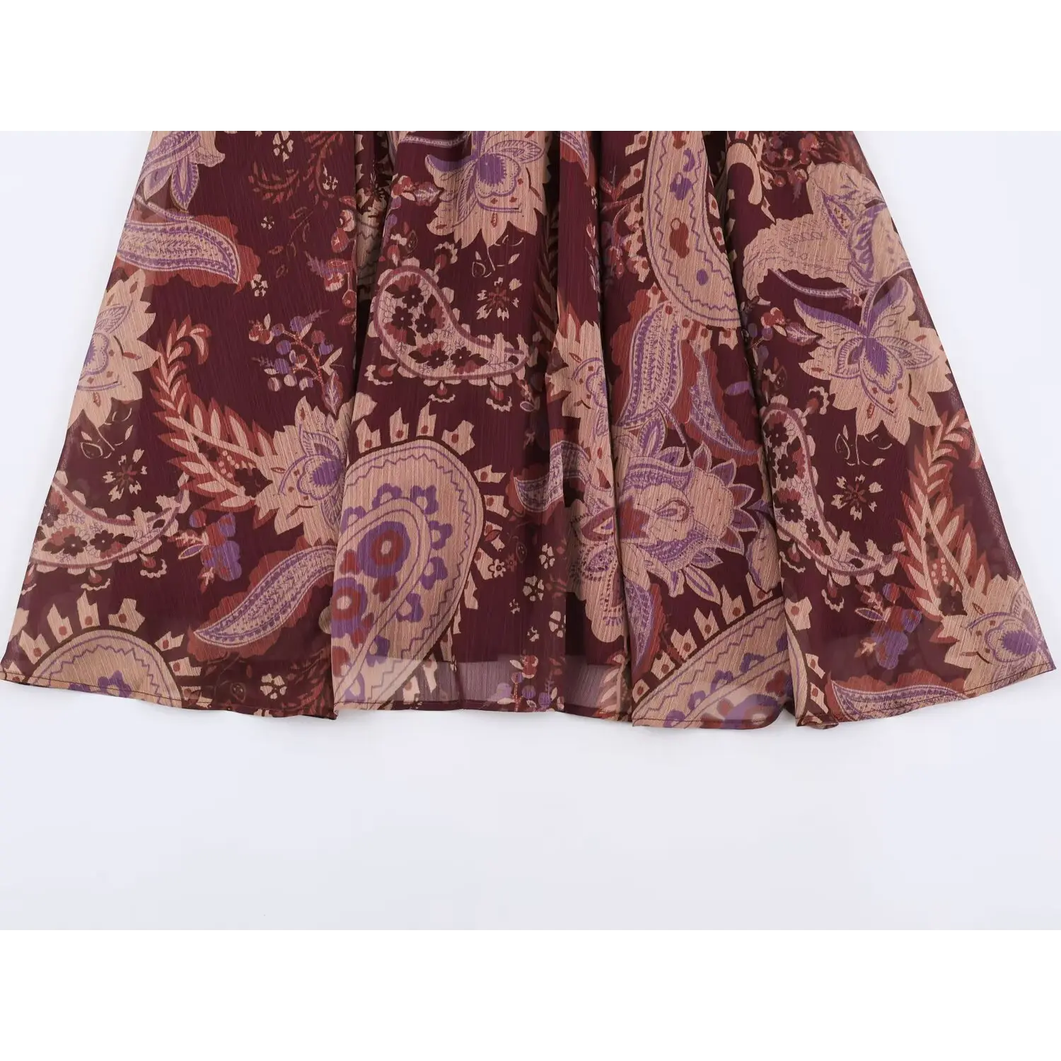 Full hem view of flowy swing long skirt on burgundy boho paisley maxi dress