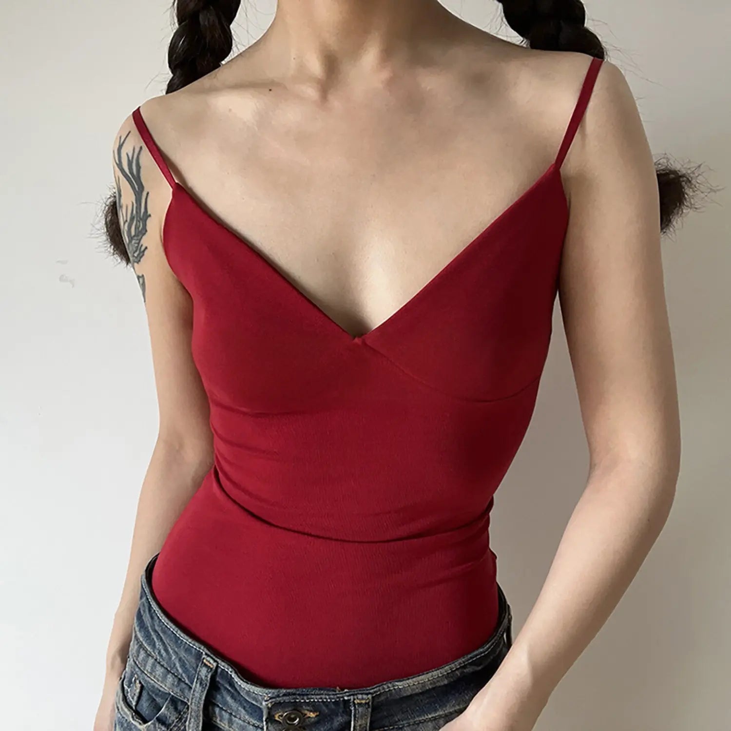Front full shot wine red deep V cami tank top, sleek stretch ribbed fabric, waist shaping ruched design thin spaghetti straps women layering singlet