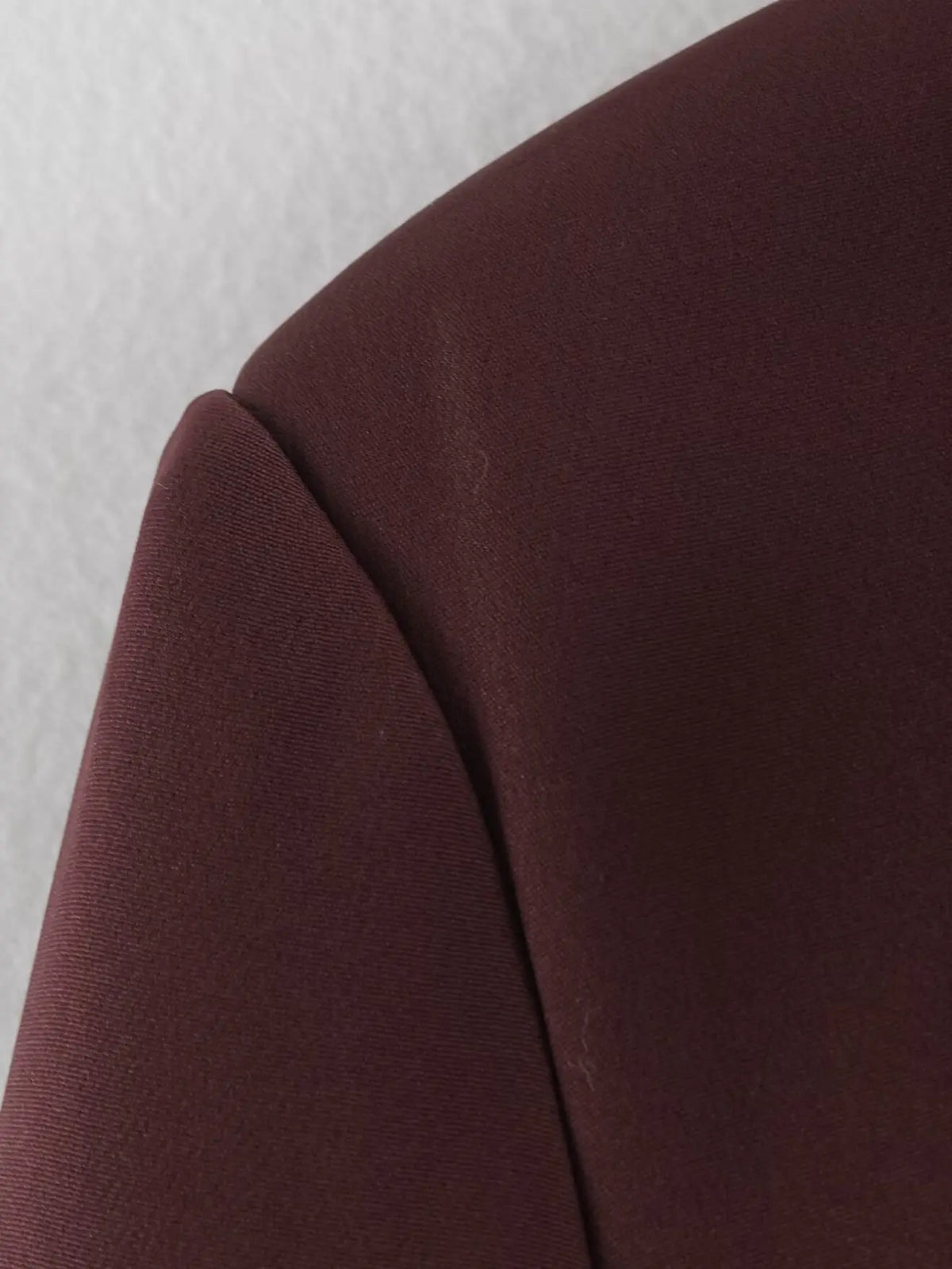 Close-up of shoulder seam and suiting fabric texture
