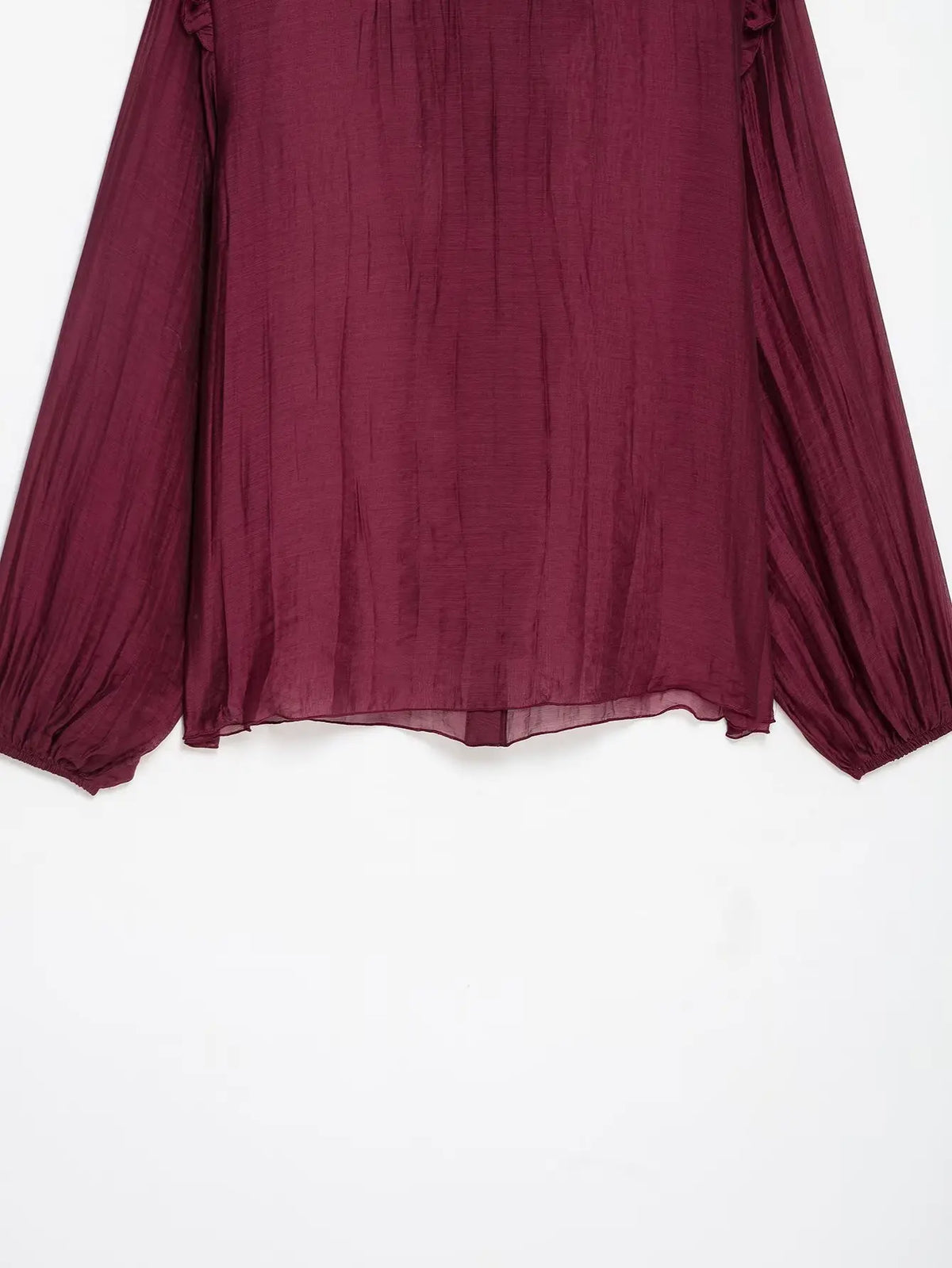 Close-up of back hem and sheer balloon cuffs