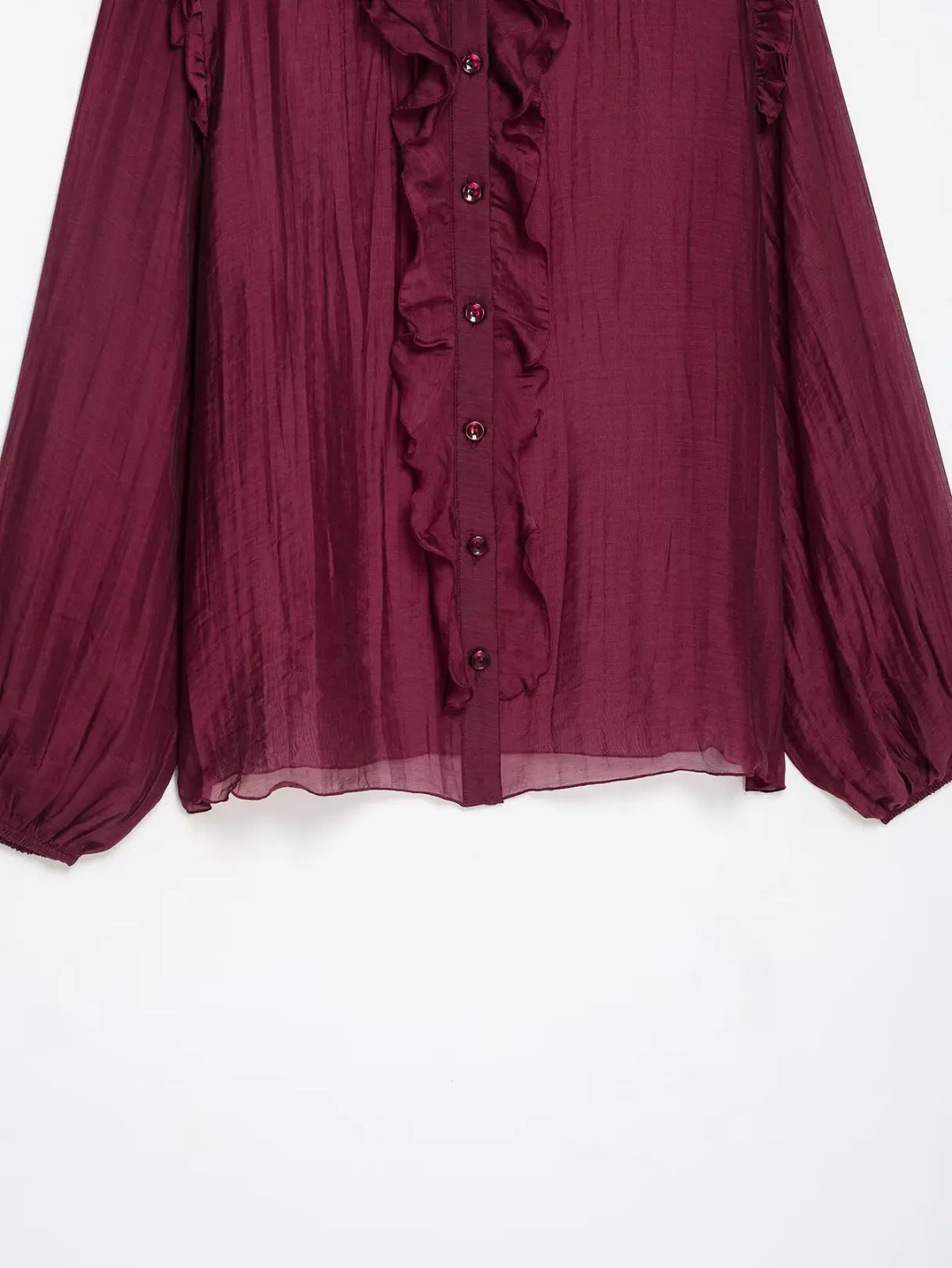 Close-up of front button placket and ruffle trim
