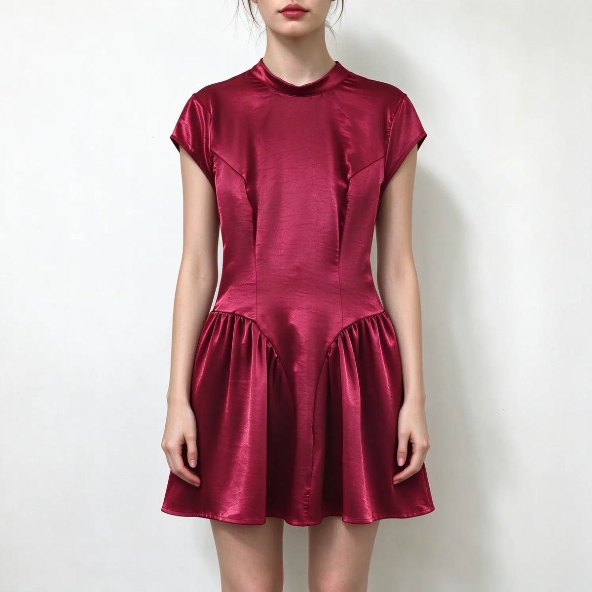 Model wearing burgundy satin cap sleeve mini dress with stand collar and gathered flared skirt, plain white background