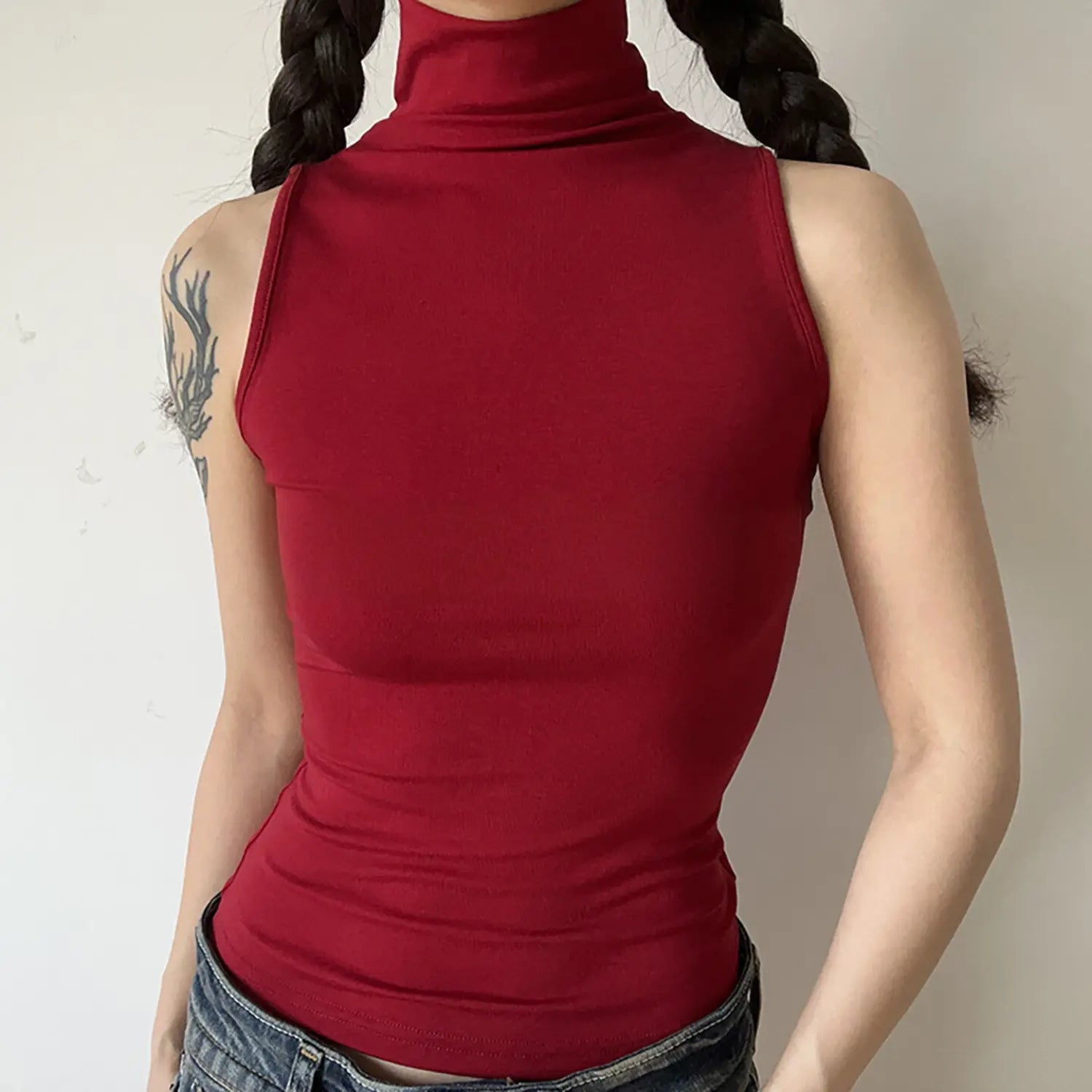 Front torso shot, burgundy red sleeveless high turtleneck tank top, slim fit