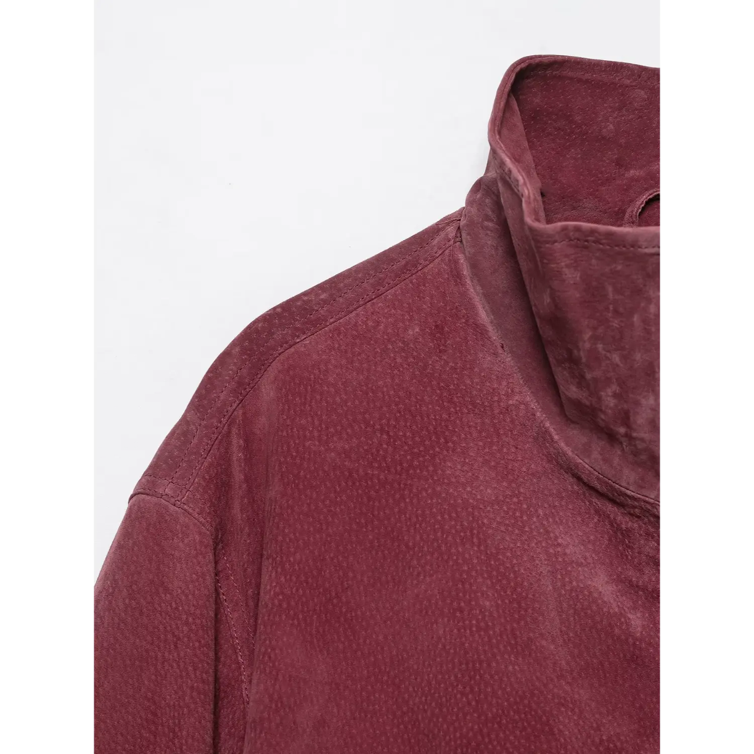 Close-up shoulder and stand collar texture detail burgundy suede bomber jacket