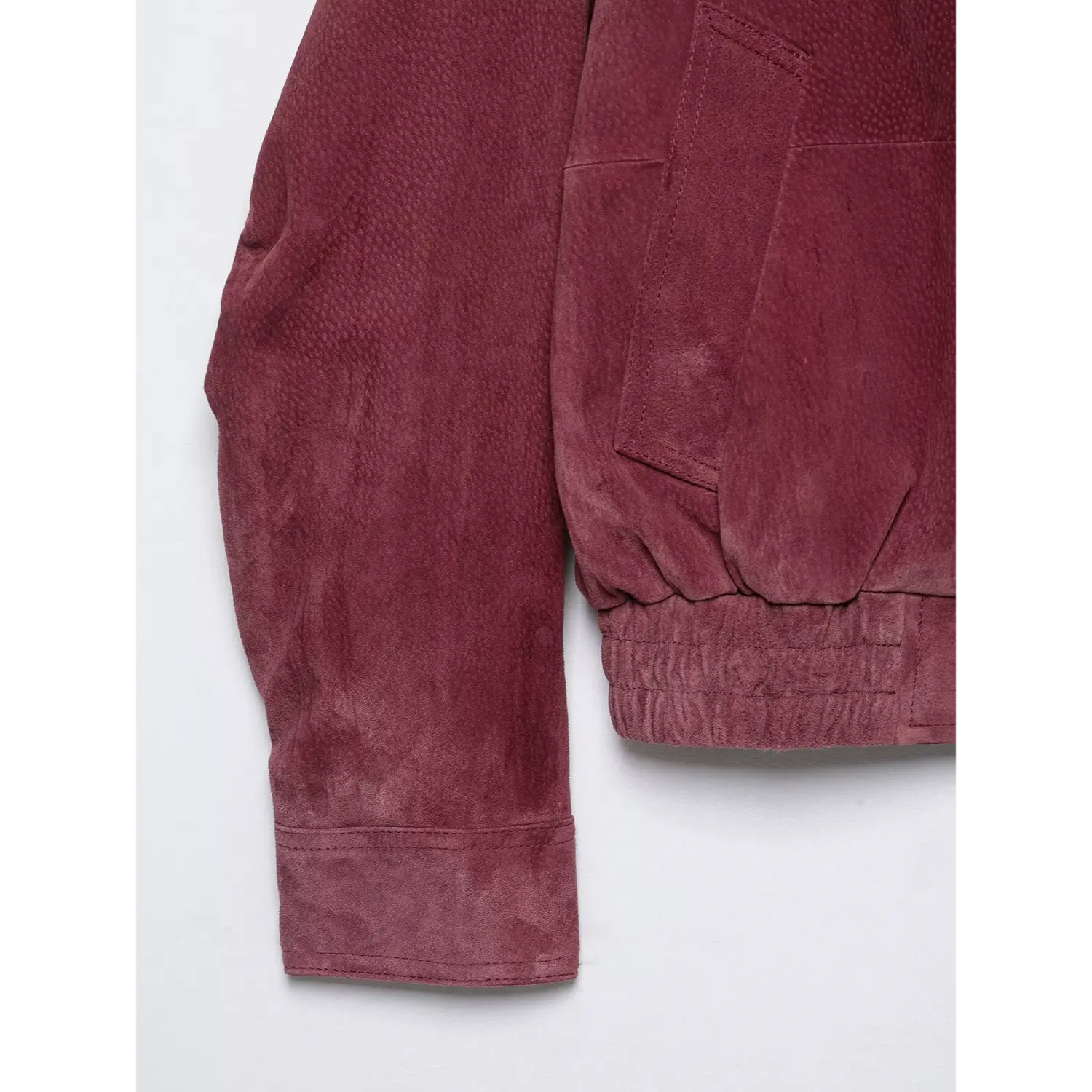 Detail shot side pocket, sleeve cuff and elastic hem burgundy suede cropped jacket