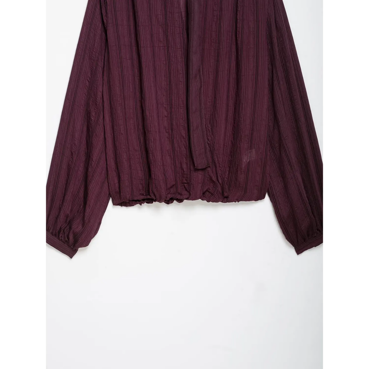 Close-up of back elastic hem and tie strap