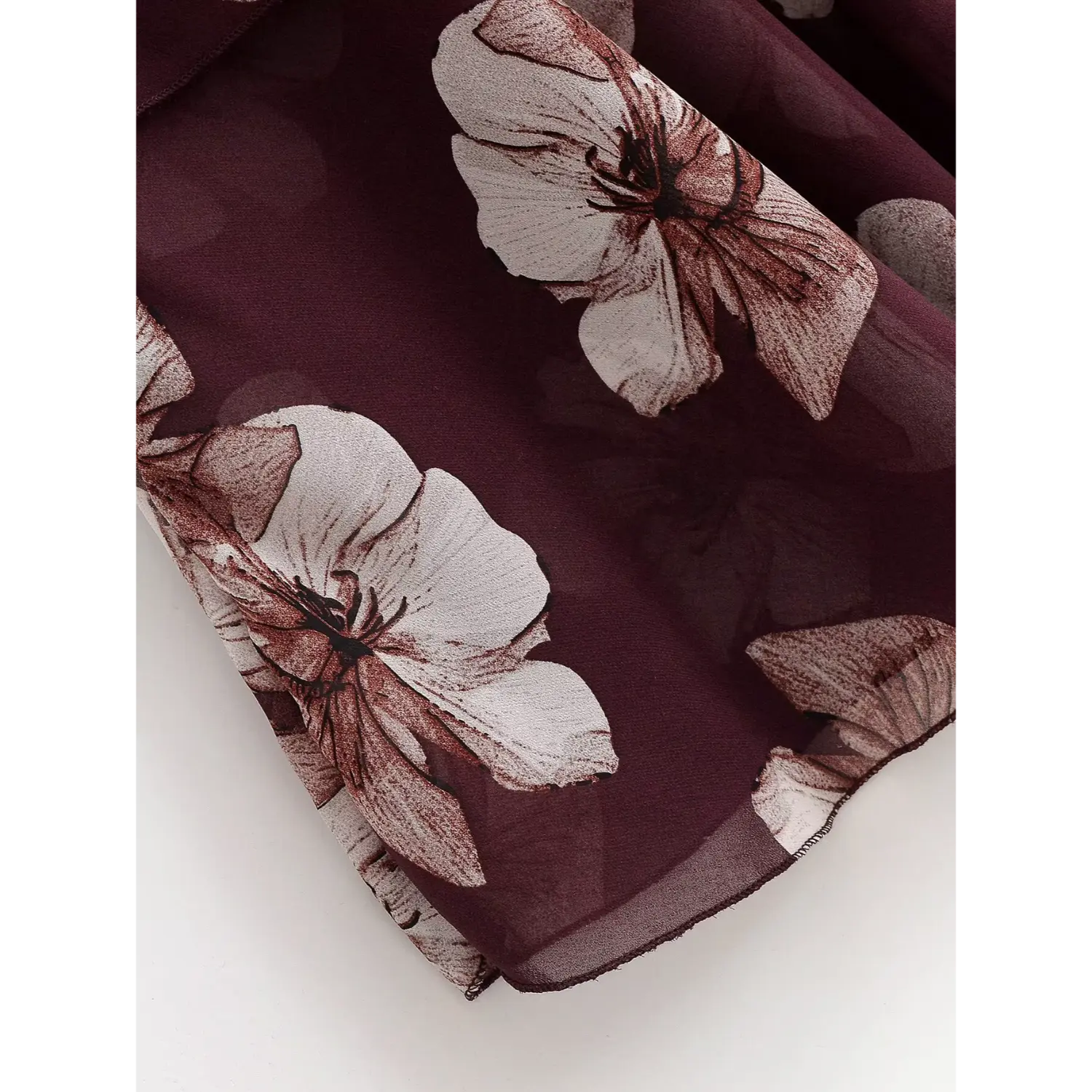 Close‑up of lightweight sheer chiffon fabric and flower print