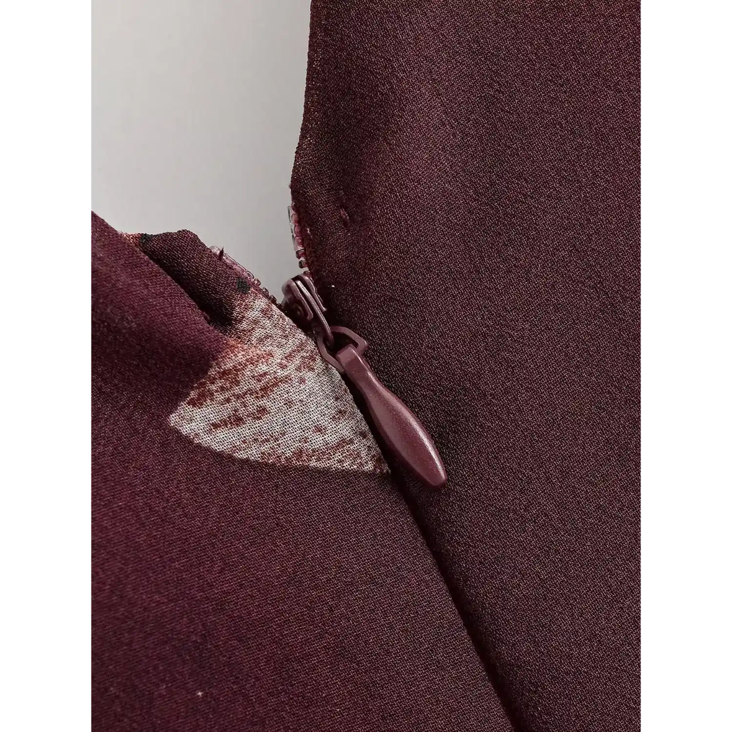 Macro close‑up of hidden back zipper detail