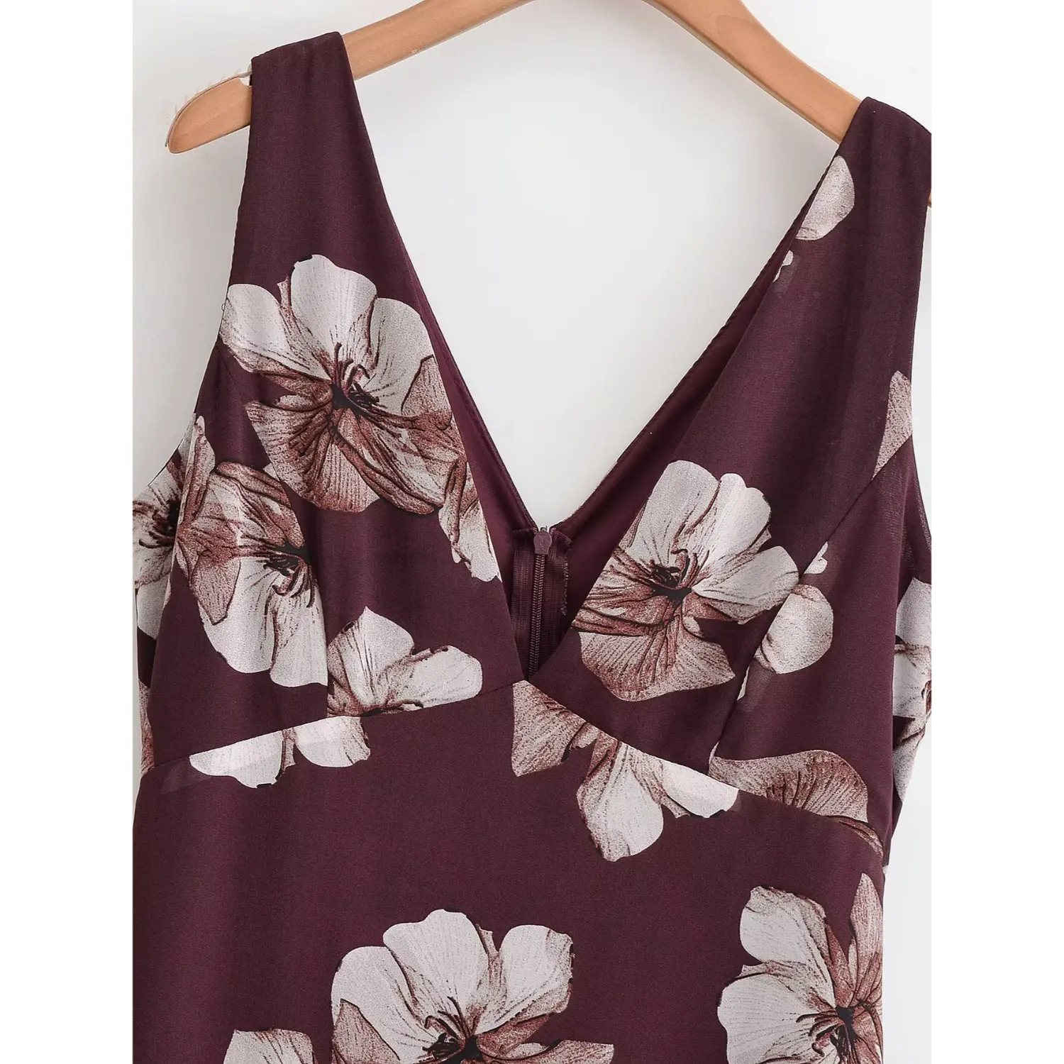 Close‑up of deep v‑neck sleeveless bodice with floral print