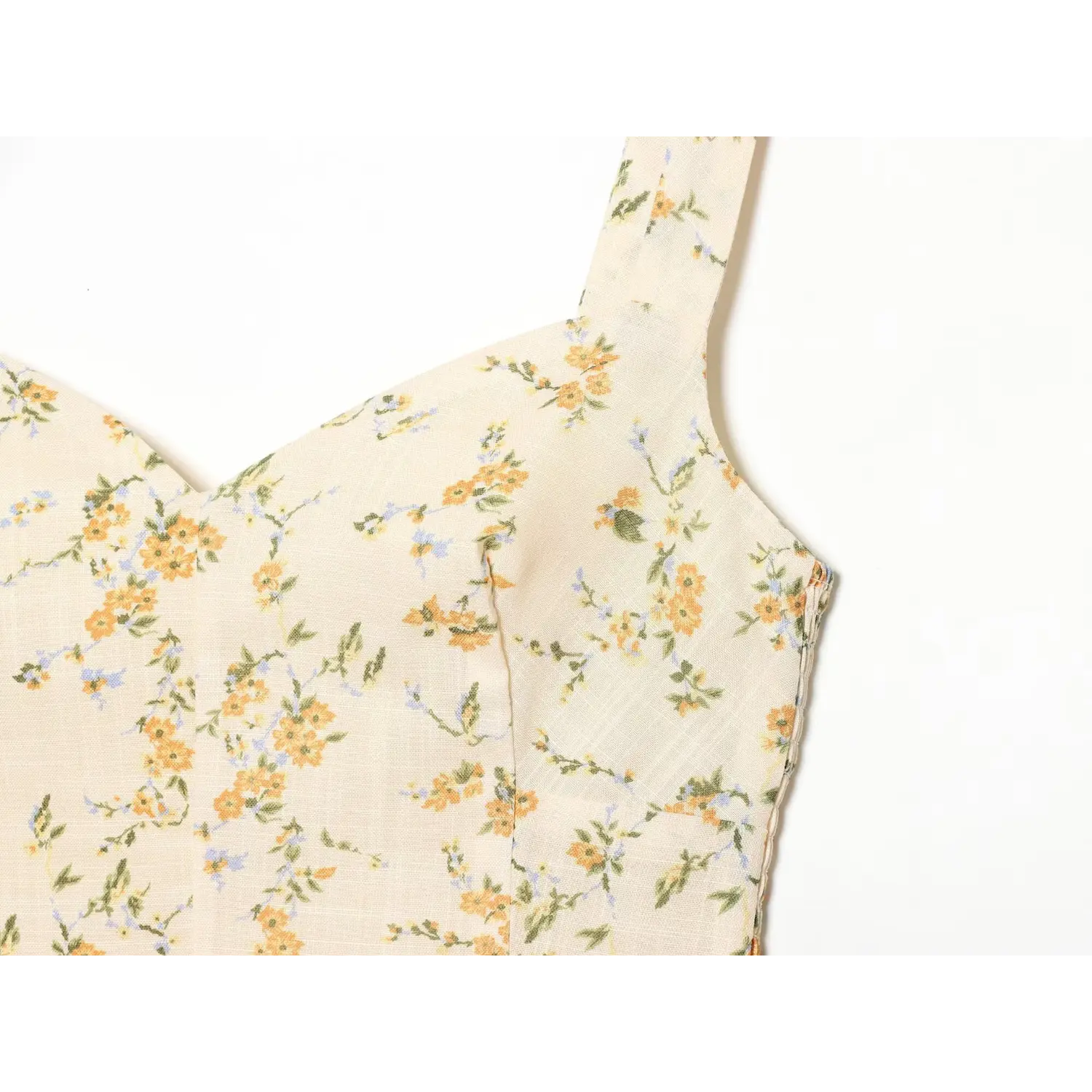 Bust dart splice floral sundress macro close-up, two-piece shaping cut fit bust neat topstitch floral fabric craft shot