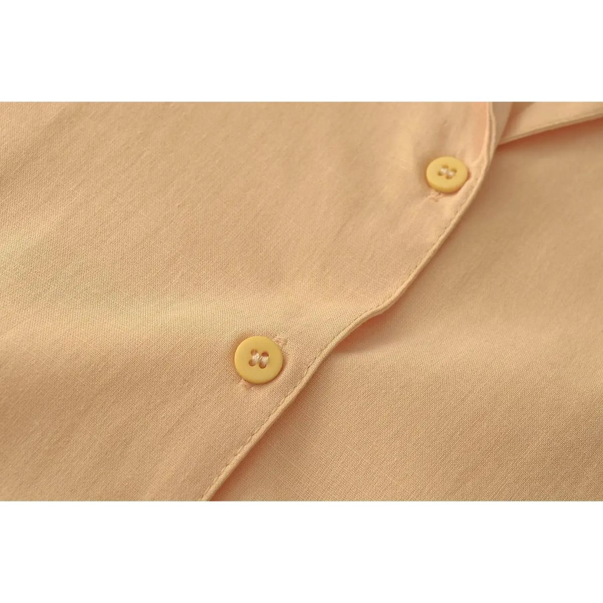 Close-up of matching yellow button detail