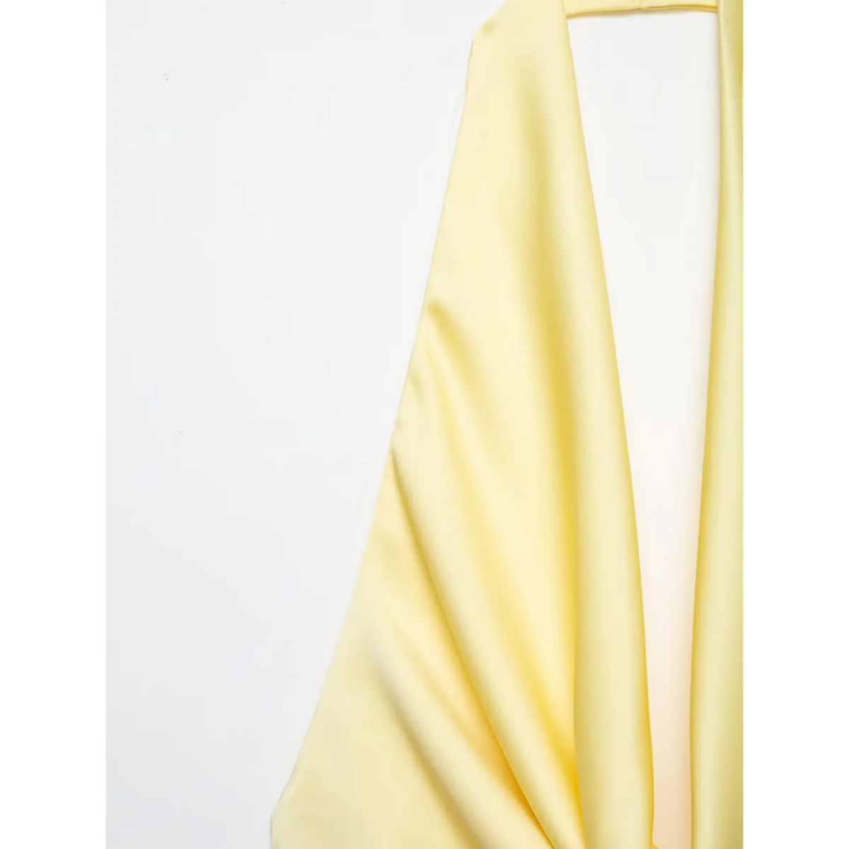 Close-up of halter cowl neck and satin fabric