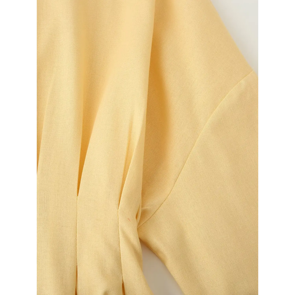 Close-up of armhole and stitching