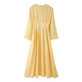 Front flat lay of butter yellow tie waist batwing sleeve maxi dress