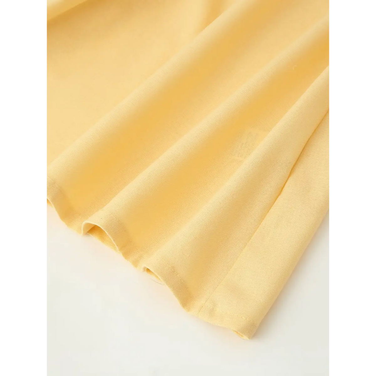 Close-up of skirt hem pleats and stitching