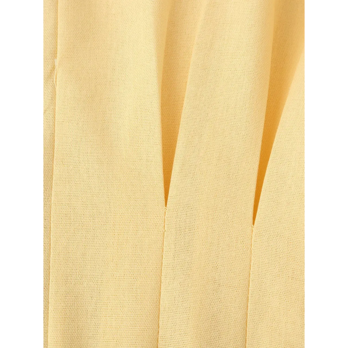Close-up of waist pleats and linen fabric