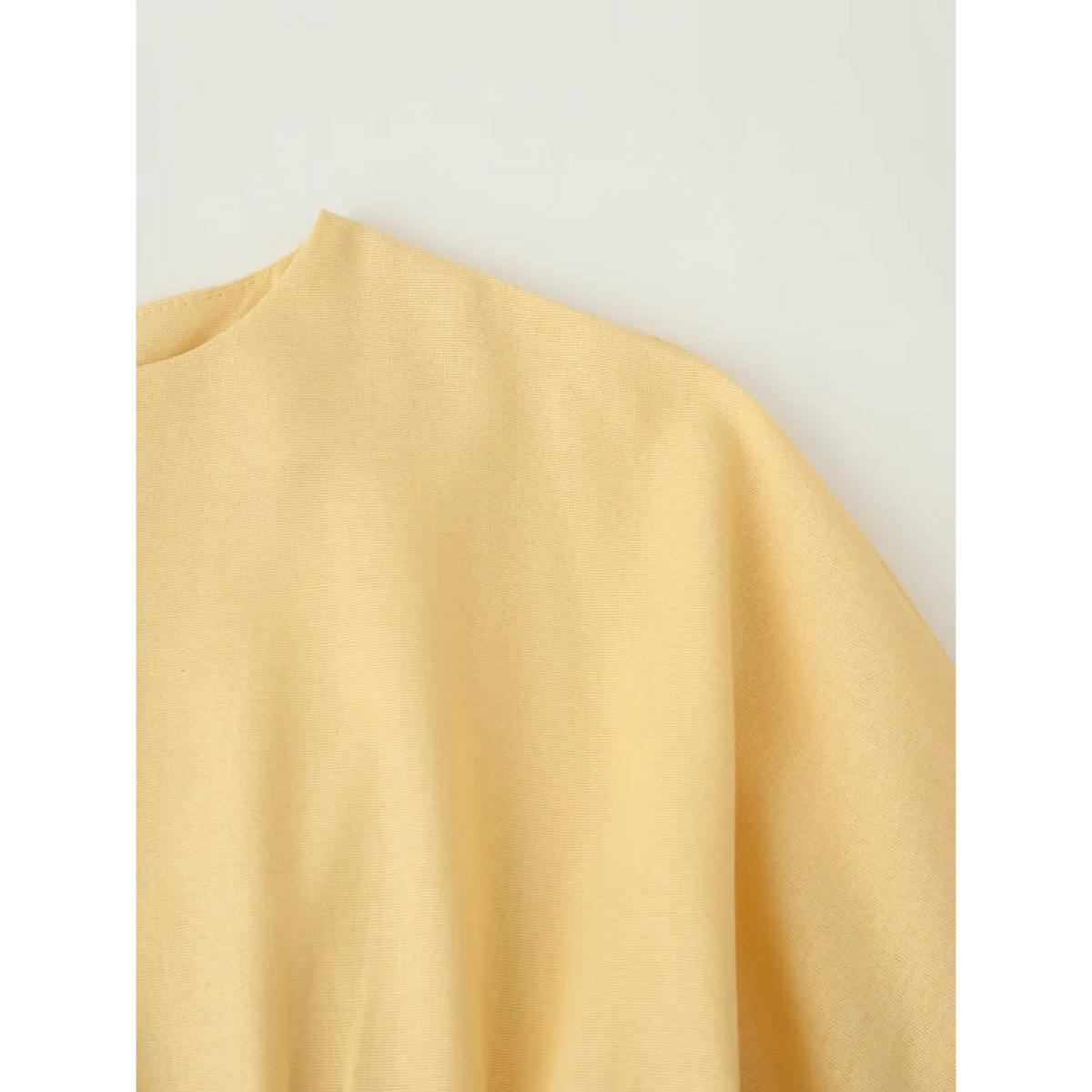 Close-up of drop shoulder and batwing sleeve