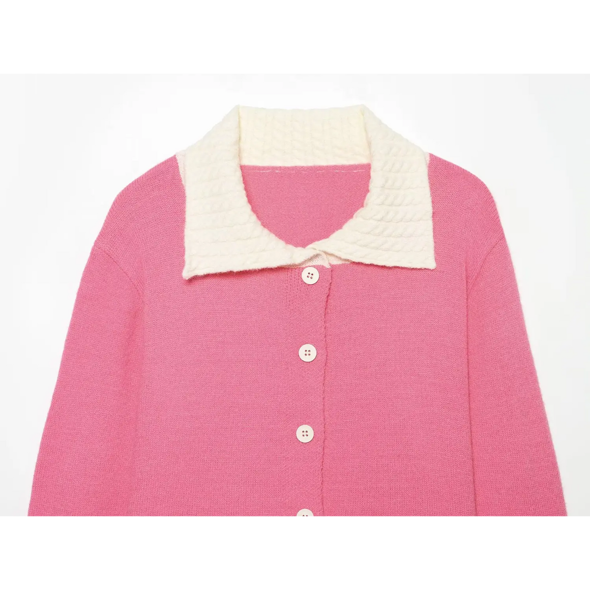Close up of pink sweater, white cable textured turn down collar and front button placket