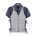 Grey cable knit vest with side tie details over navy plaid short‑sleeve shirt, 2 piece outfit flat lay