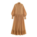 Front flat‑lay of camel stand collar maxi dress, frog button details, balloon long sleeves, drawstring waist and ruffle hem