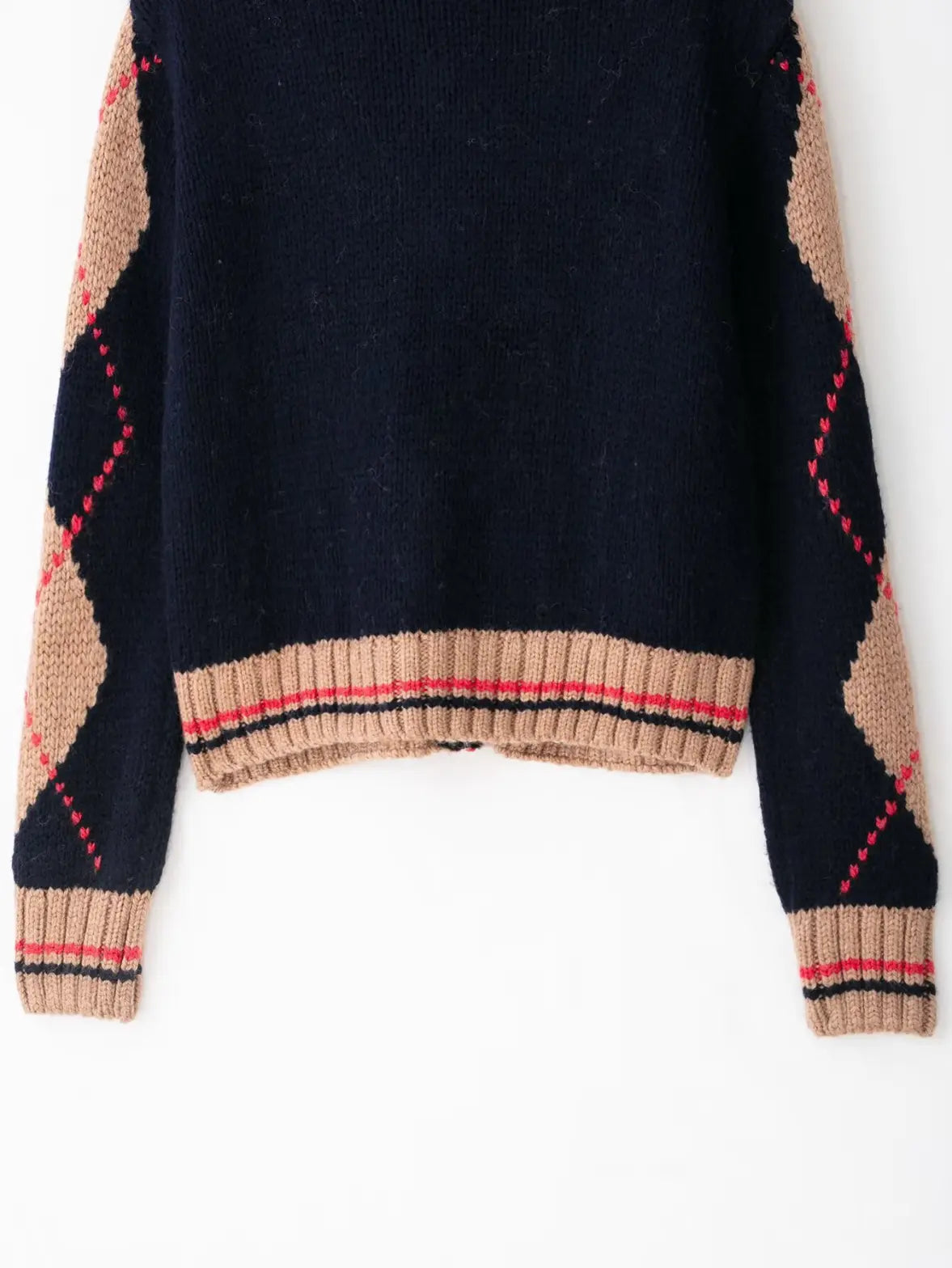 Close-up of back hem and ribbed cuffs