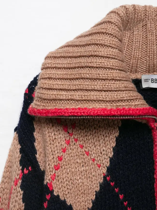 Close-up of ribbed turtleneck collar and red trim zipper