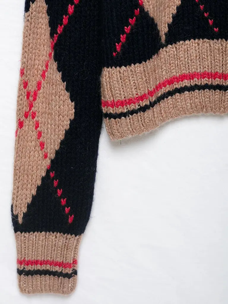 Close-up of ribbed hem stripe detail and argyle knit