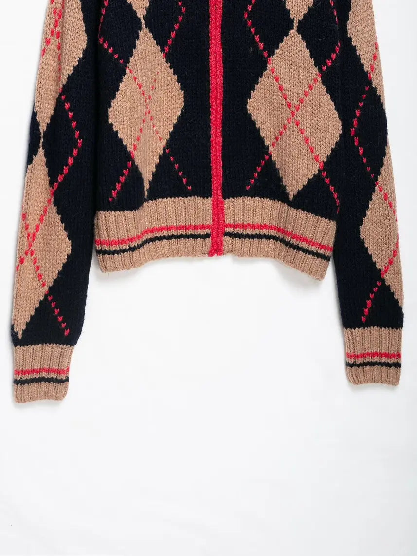 Close-up of ribbed waistband and red black stripe detail