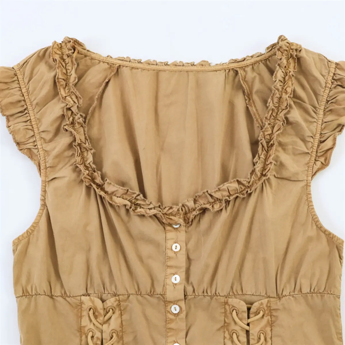 Camel-colored ruffled bodice top laid flat, showing full front silhouette and details