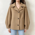 Model wearing camel spread collar button front cropped jacket with jeans, front view