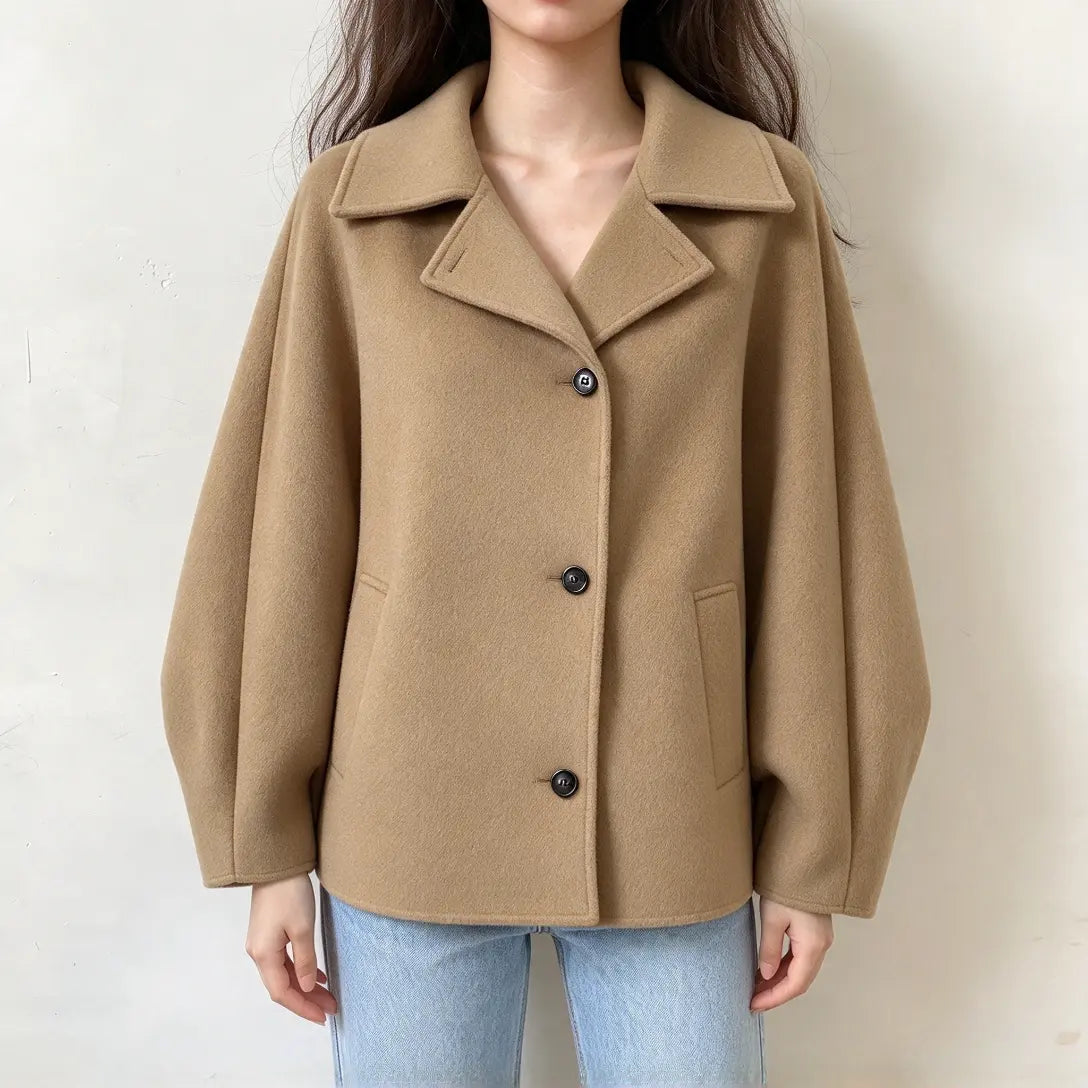 Model wearing camel spread collar button front cropped jacket with jeans, front view
