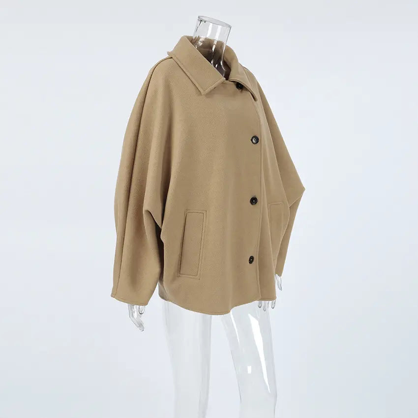 Camel spread collar button front cropped jacket on mannequin, side view
