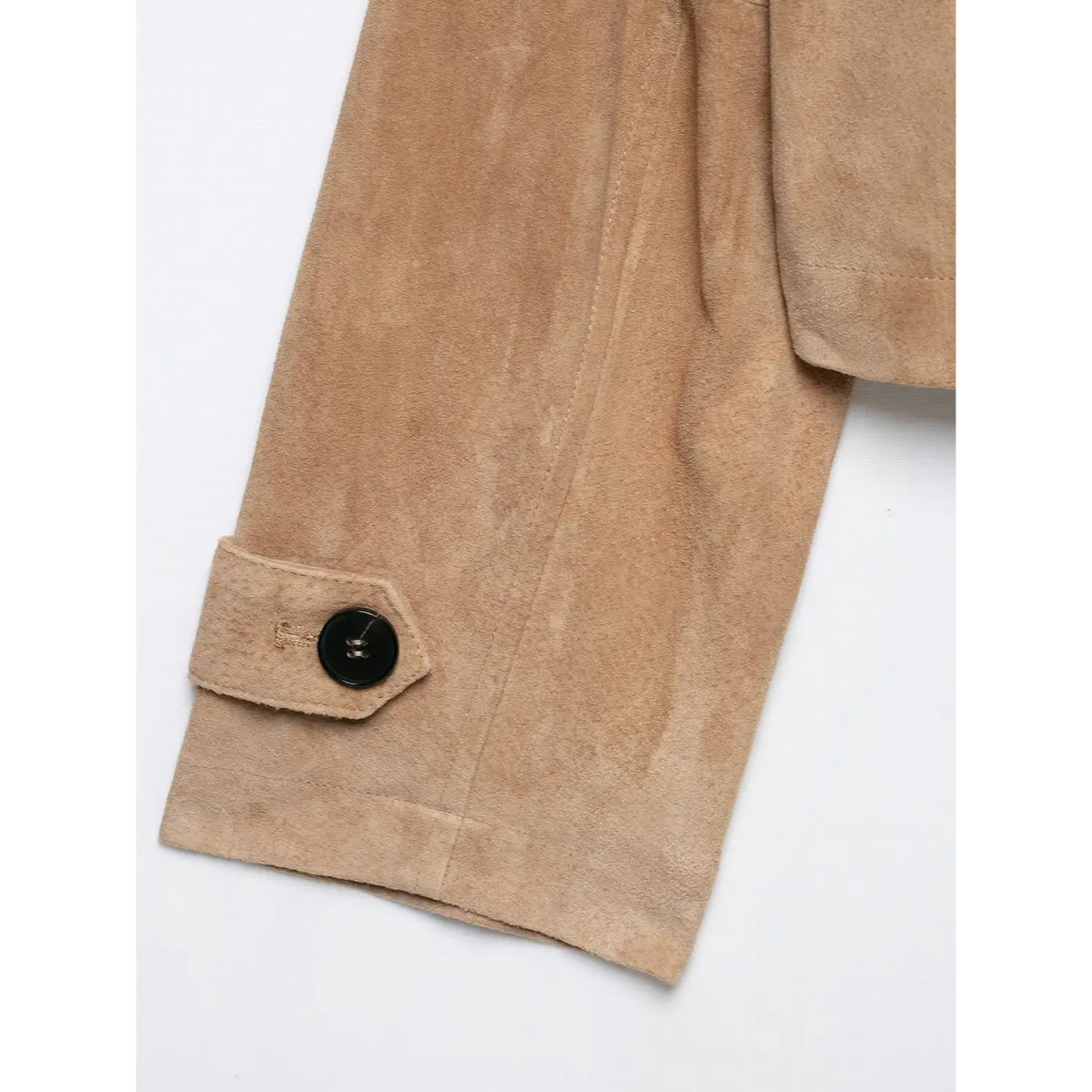 Close-up of adjustable cuff strap and black button