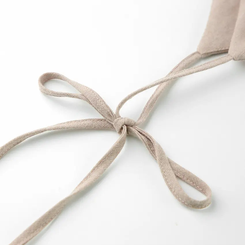 Close-up of tie shoulder strap bow