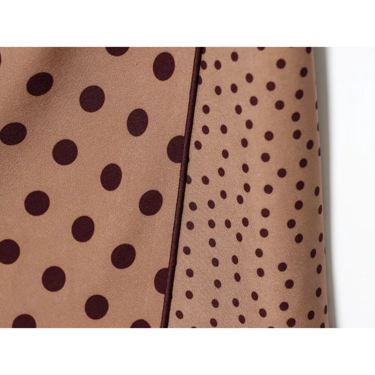 Close‑up of wrap slit seam and polka dot fabric
