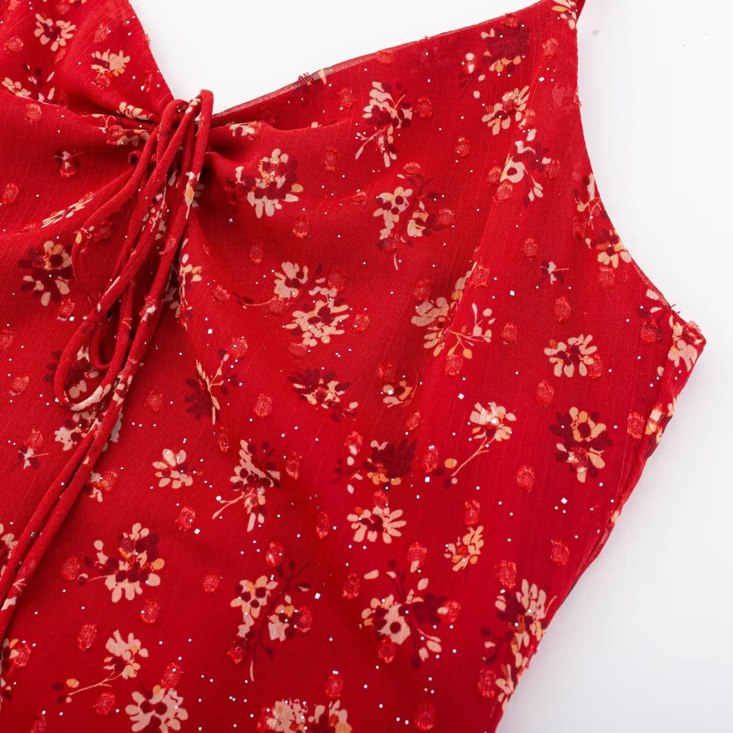 Cami strap floral binding macro close-up, chiffon print tight serging thin strap mini ruffle soft shoulder coverage sewing detail shot