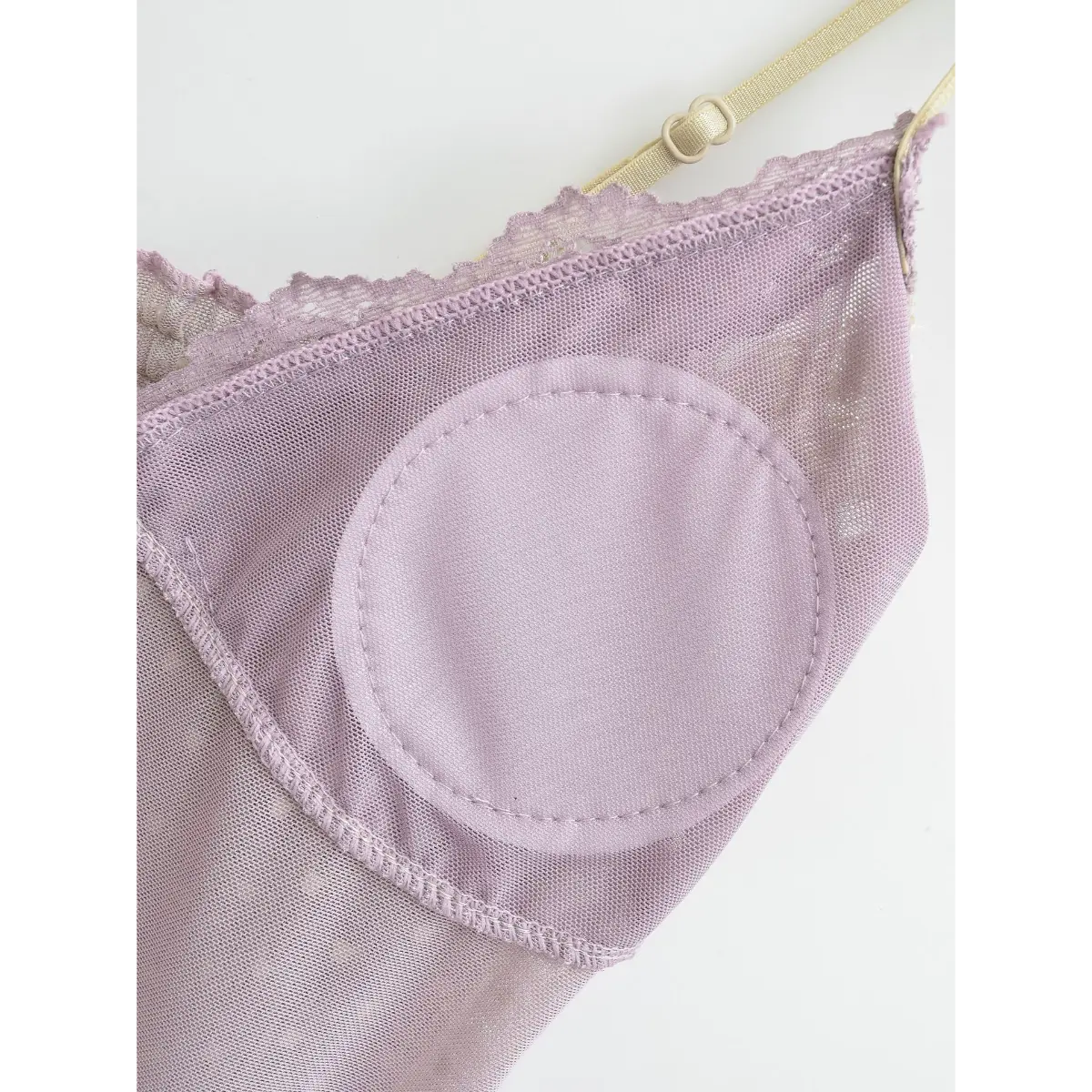 Close-up of the built-in bra lining and the edge of the adjustable strap.