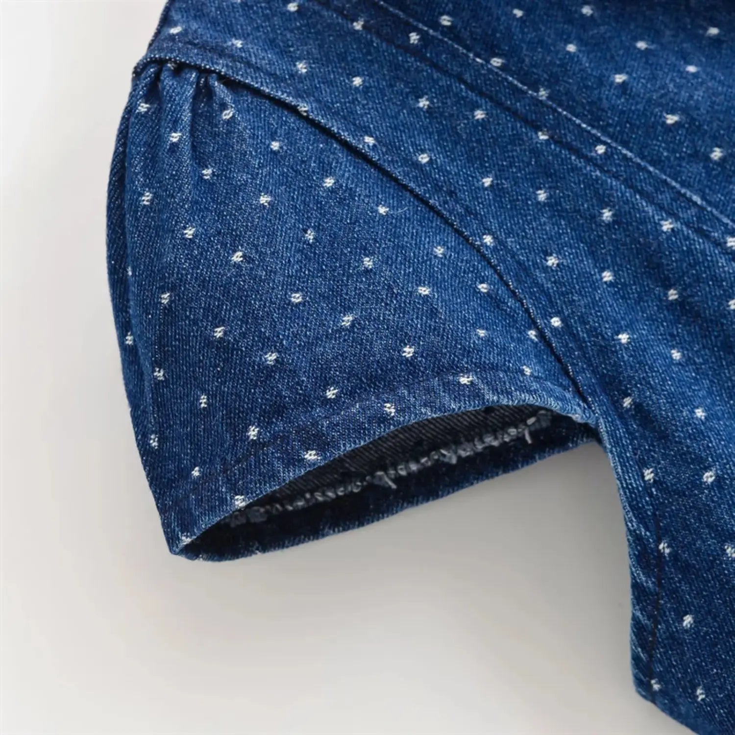 Sleeve shoulder partial shot, double tier gathering for bubble cap sleeve, twill denim natural folds, evenly distributed dots